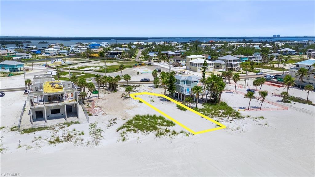 Drone / aerial view with a residential view and a water view  - Virtually Edited Image