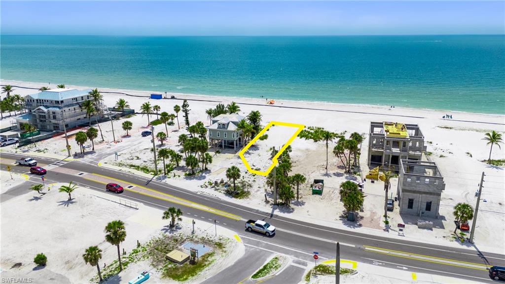 Drone / aerial view featuring a water view and a beach view  - Virtually Edited Image