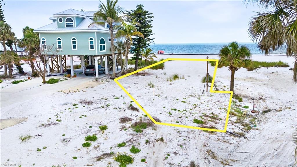 Bird's eye view featuring a beach view and a water view  - Virtually Edited Image