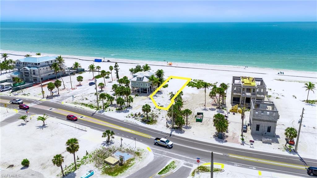 Bird's eye view featuring a water view and a view of the beach  - Virtually Edited Image