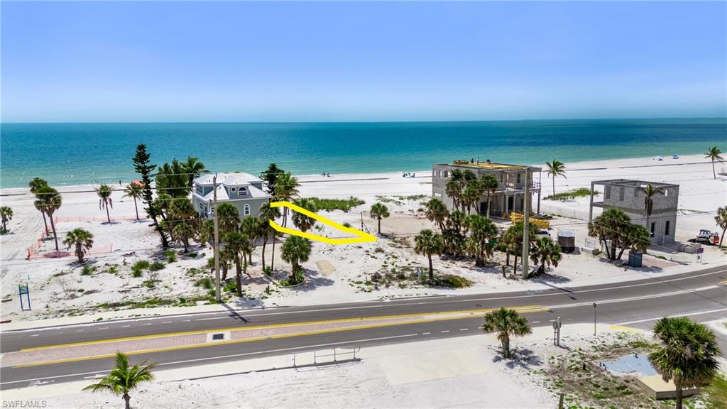 Property view of water featuring a view of the beach  - Virtually Edited Image