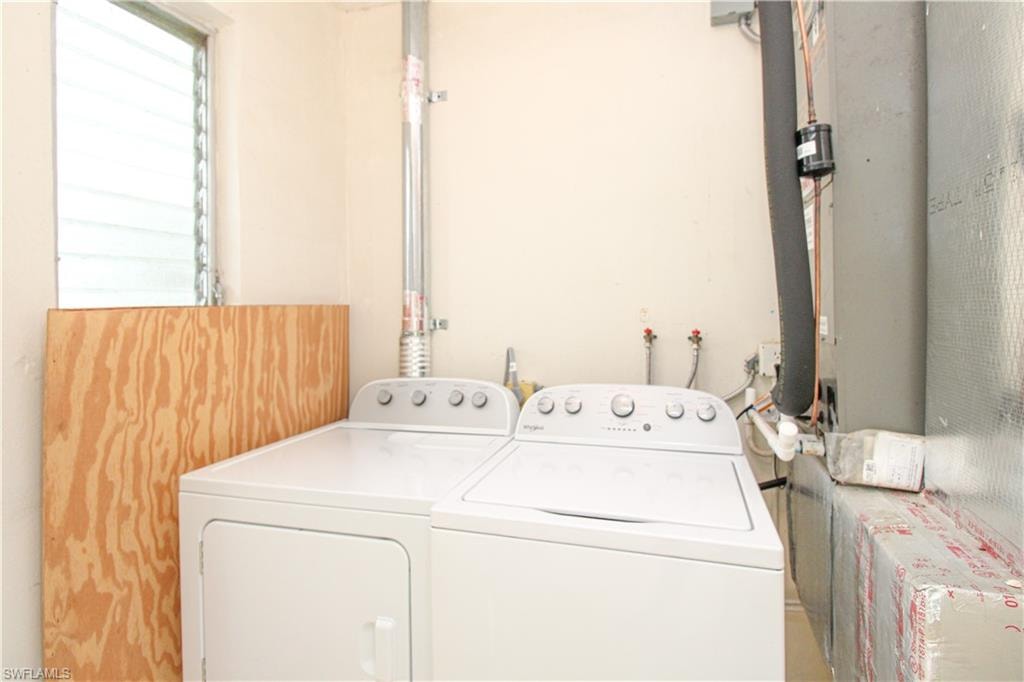 Washroom featuring washing machine and clothes dryer