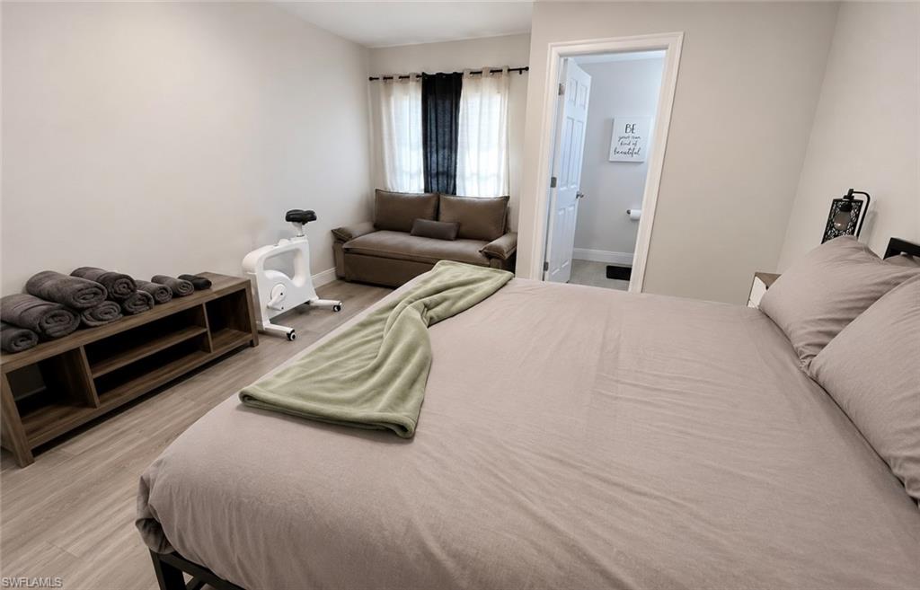 Light gray walls complement the wood-finish flooring