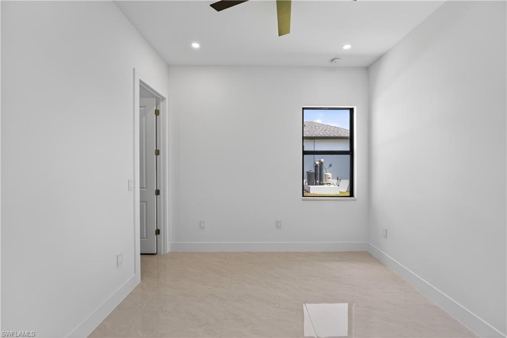 Walk-in shower featuring a ceiling-mounted rainfall showerhead and a wall-mounted square showerhead