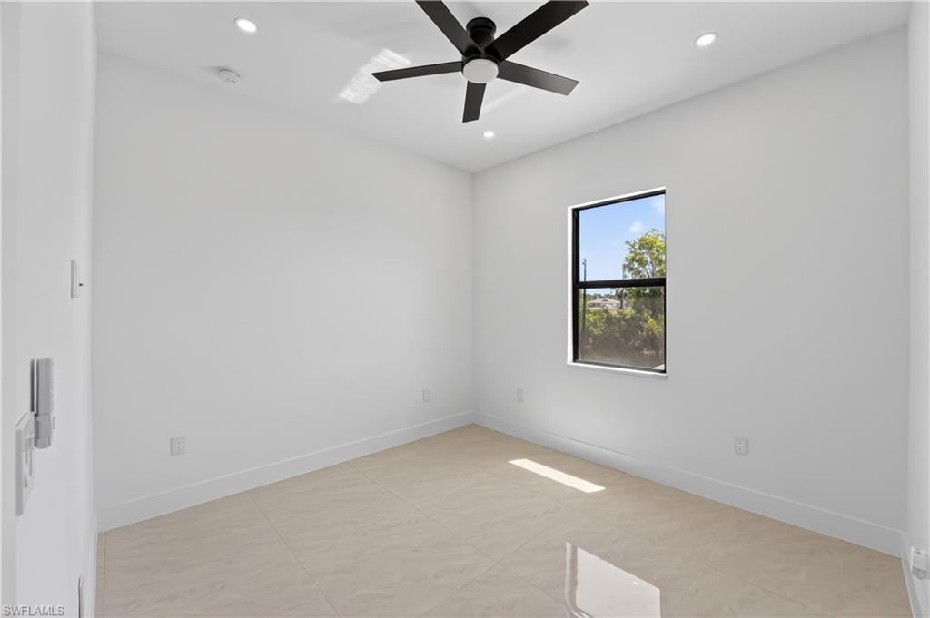 Walk-in shower featuring a ceiling-mounted rainfall showerhead and a wall-mounted square showerhead