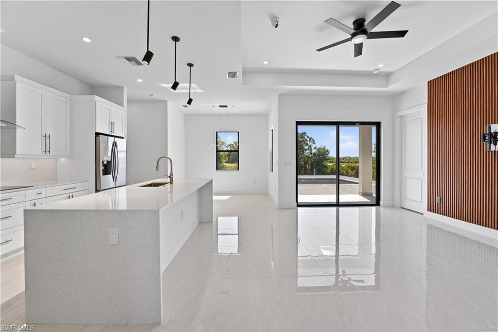 Open-concept living area with large-format tile flooring