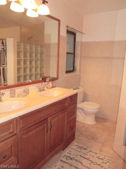 Double vanity with wood-finish cabinetry and light-toned countertop