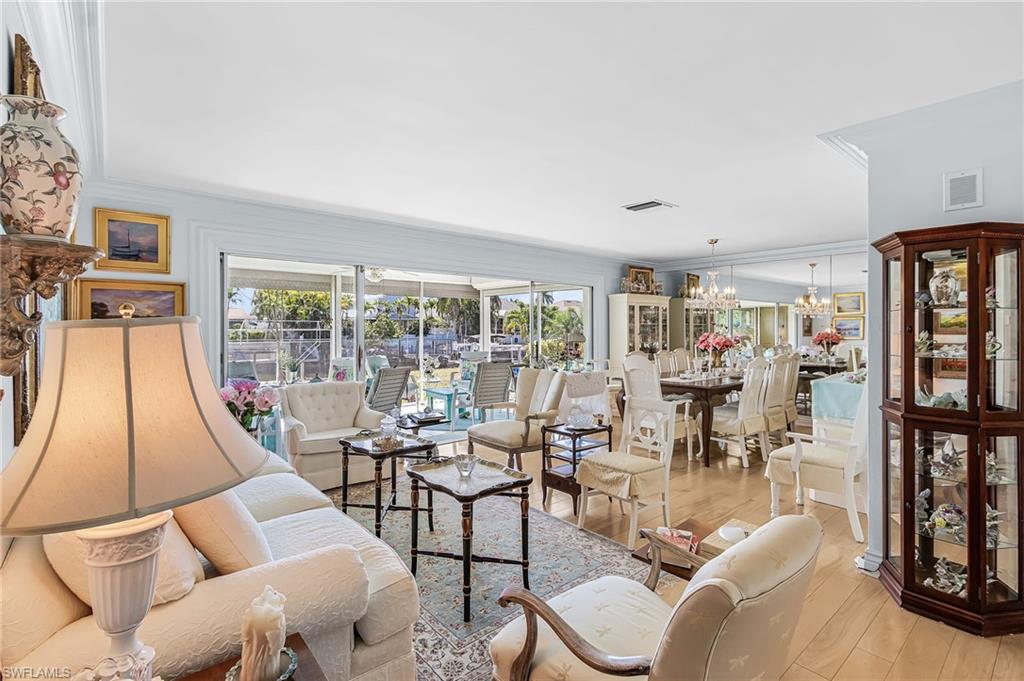 Room with water view and sliders to sunroom