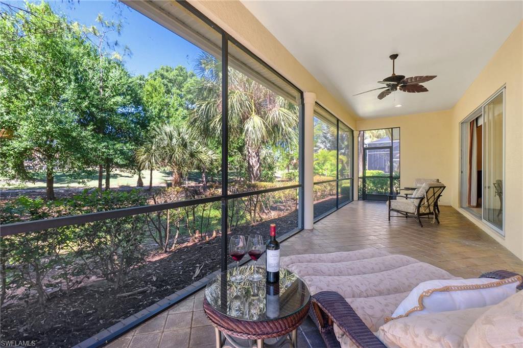 Sunroom / solarium featuring ceiling fan