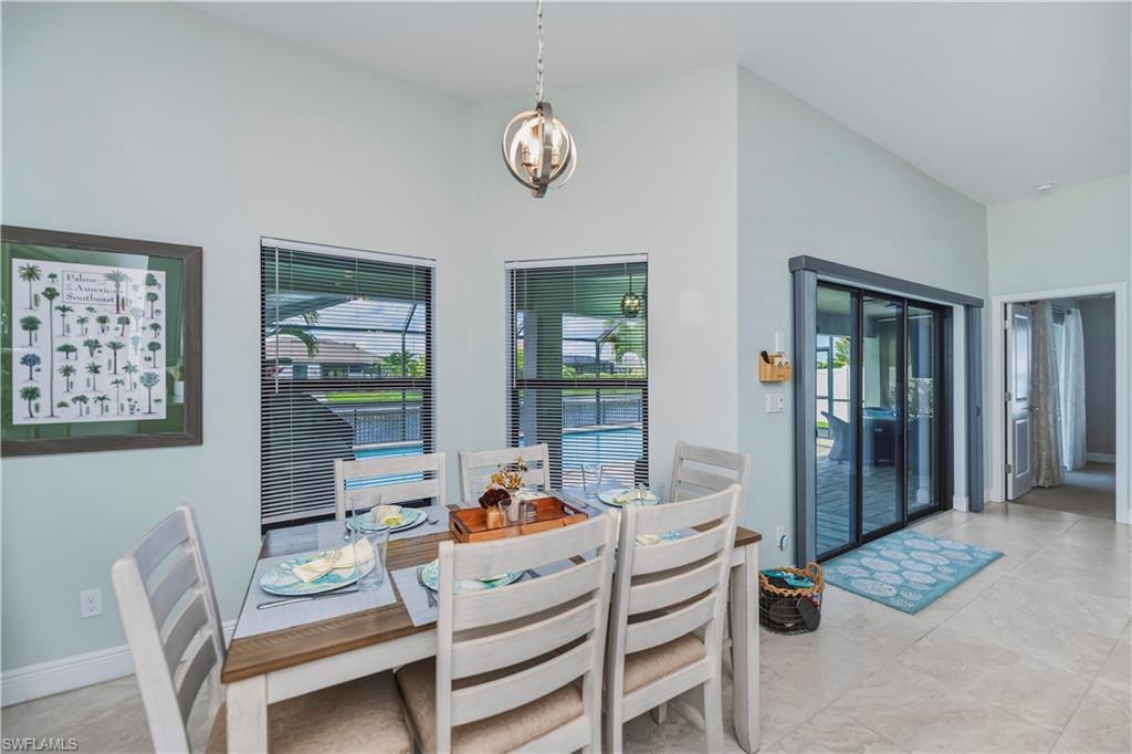 eat in kitchen area looking out to lanai and pool