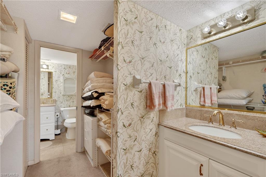 Master Bathroom and walk through closet with vanity