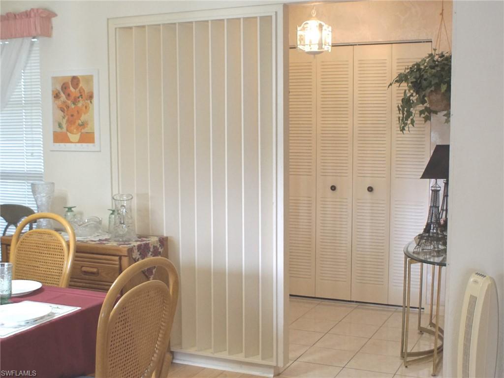 Dining space featuring light tile patterned floors
