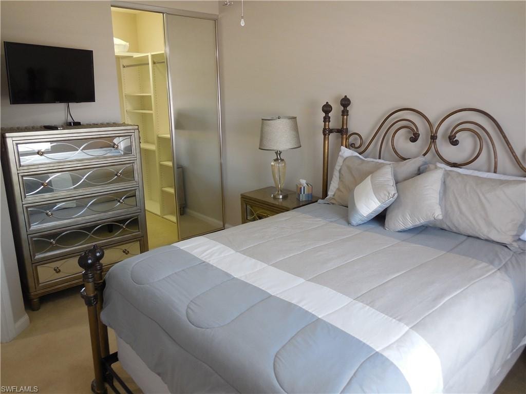 Bedroom with carpet and ensuite bath