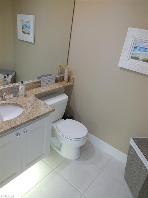 Half bath with vanity and toilet