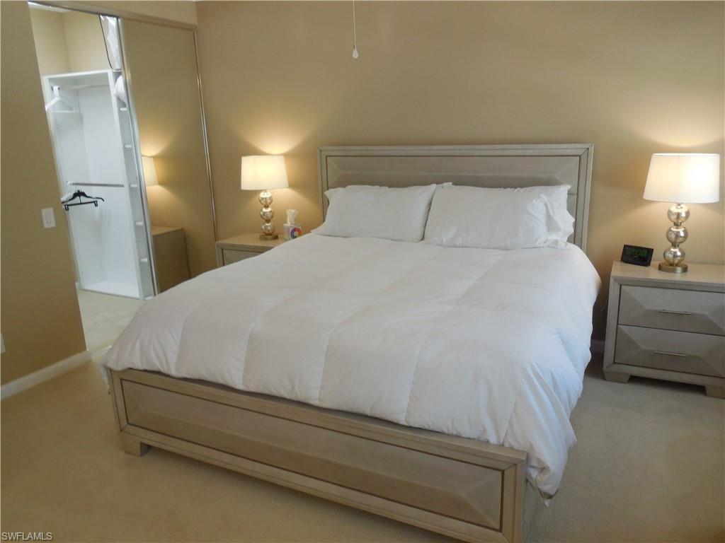 Carpeted bedroom with baseboards