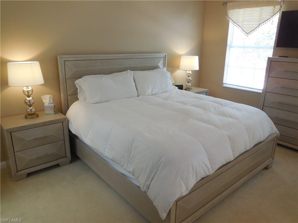 Bedroom with light carpet