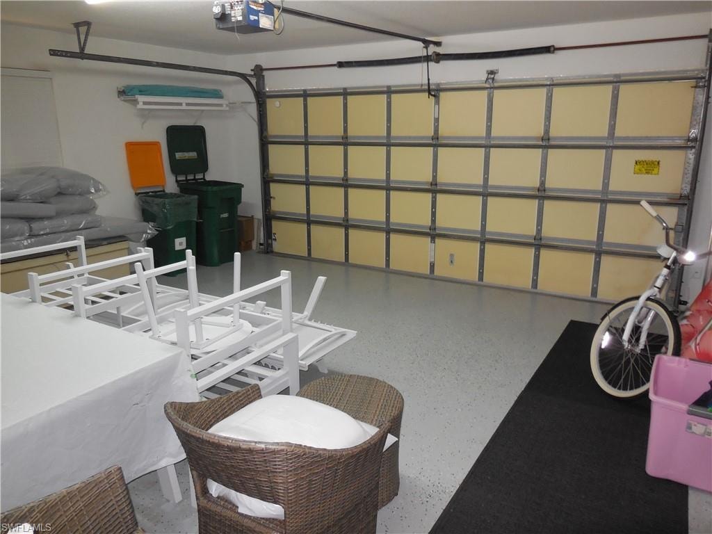 Garage featuring a garage door opener