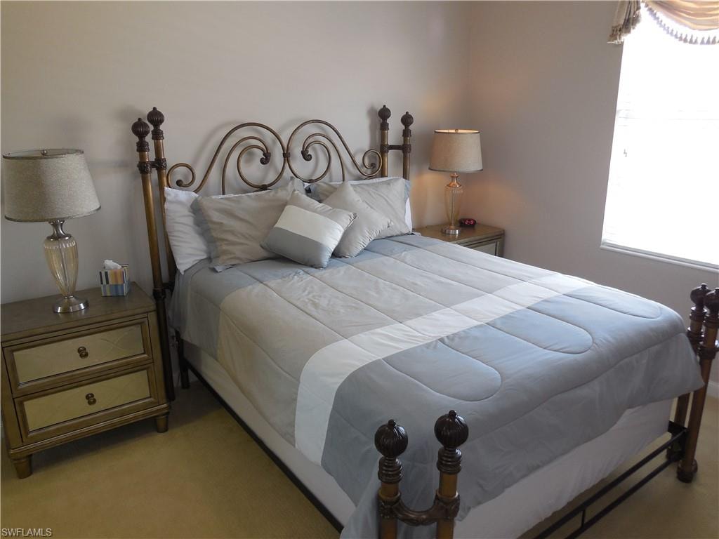 Bedroom with light carpet