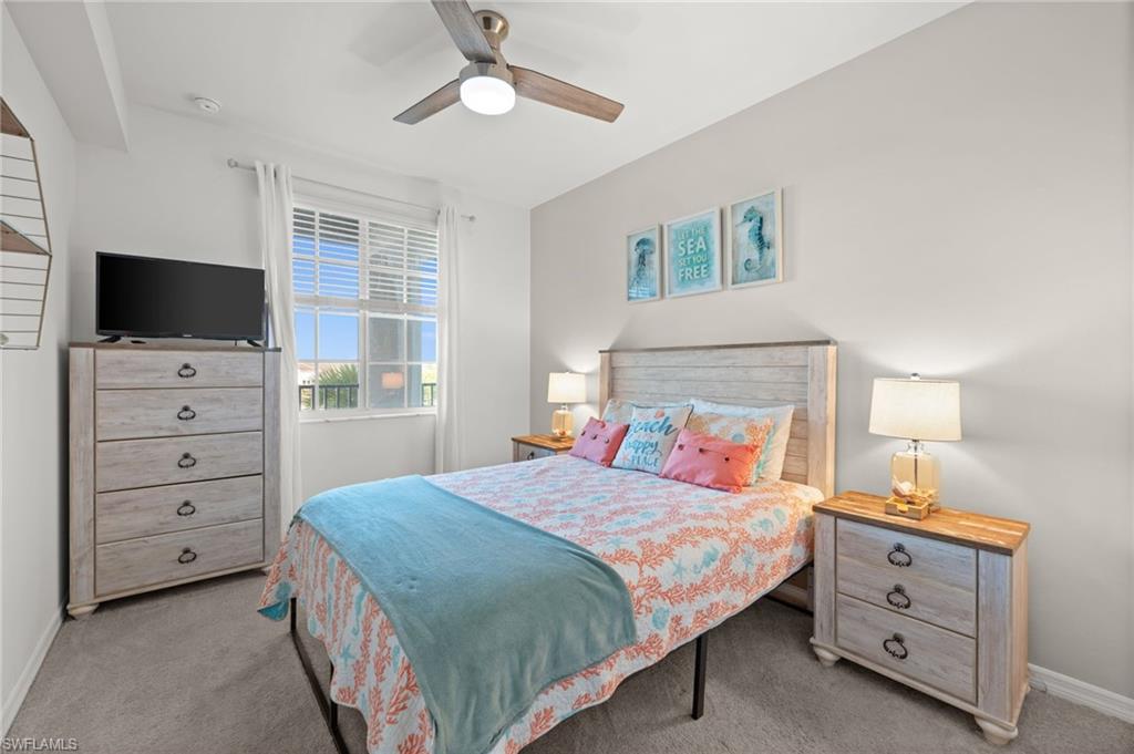 Bedroom featuring neutral-toned walls and plush carpeting