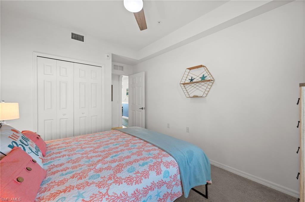 Bedroom featuring white walls and neutral carpet flooring