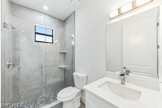 Full bath with vanity and a shower stall on main entrance side