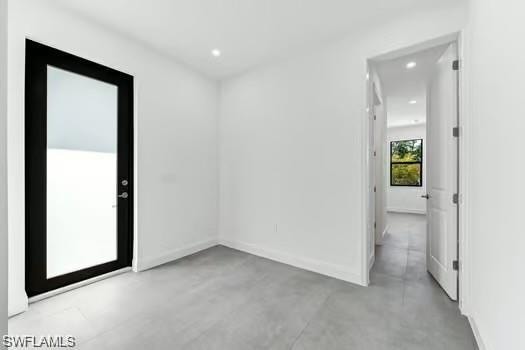 2nd Bedroom in Second Unit, room featuring concrete flooring and recessed lighting