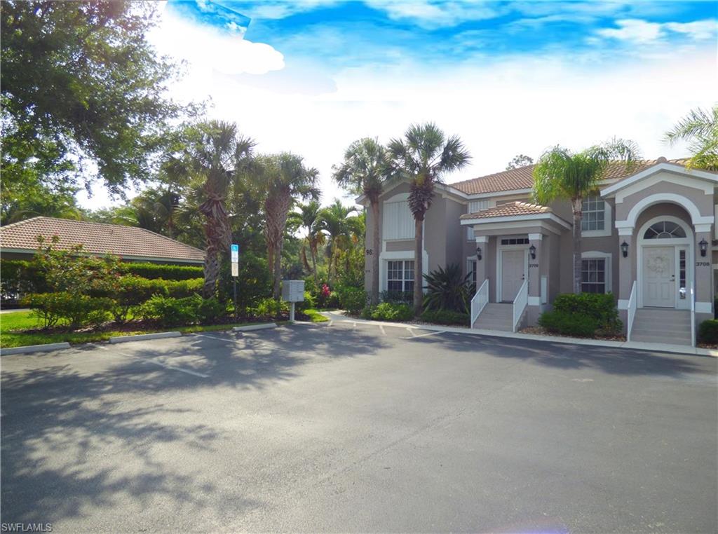 The Condo Building Is Right Next To The Pool