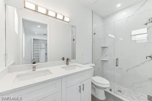 Bathroom #1 in Second Unit featuring a marble finish shower and double vanity