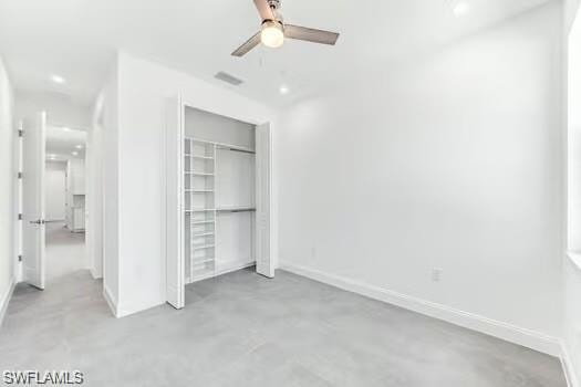 2nd Bedroom in Second Unit featuring custom closets with concrete flooring, ceiling fan, and recessed lighting