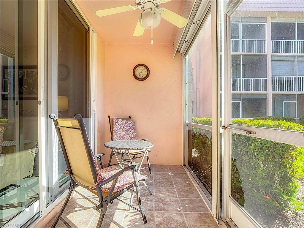 Sunroom featuring a ceiling fan