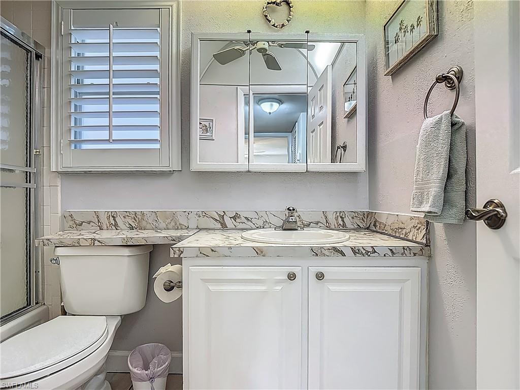 Full bathroom featuring vanity and toilet