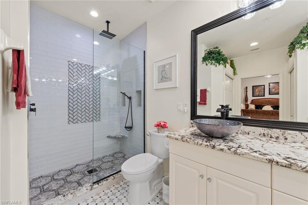 NEWLY UPDATED PRIMARY BATH WITH WALK-IN SHOWER AND SEAMLESS GLASS