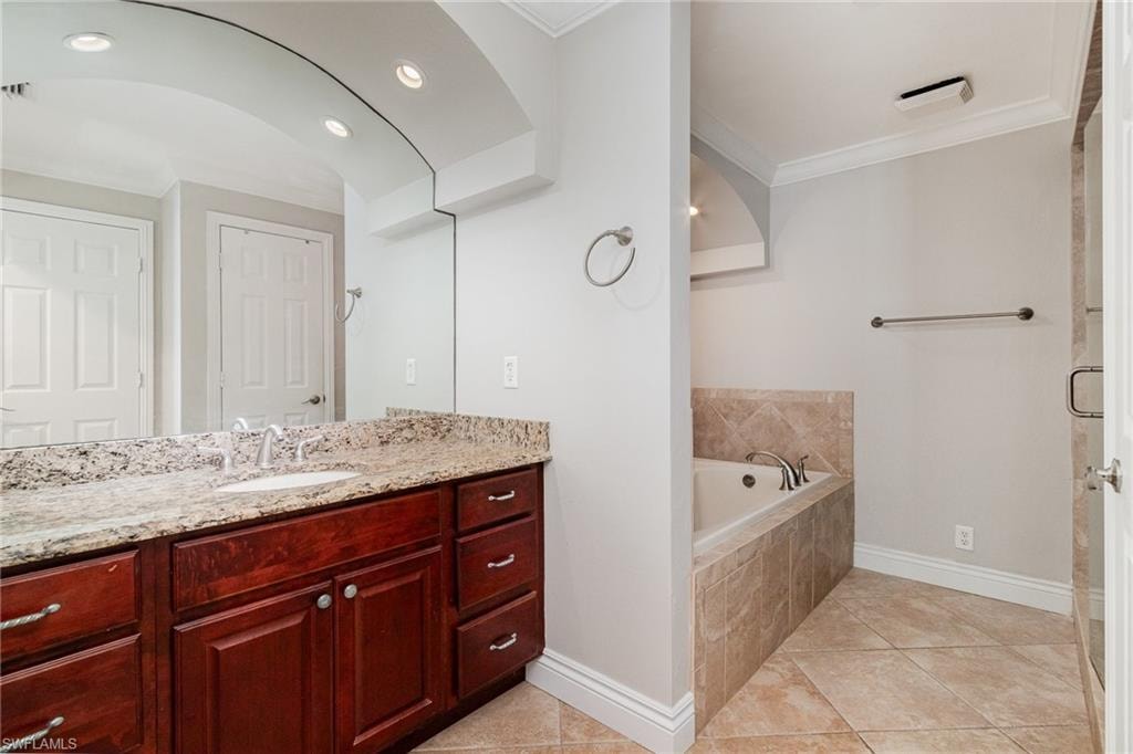 Apt "A" Master bath vaniety and tub.