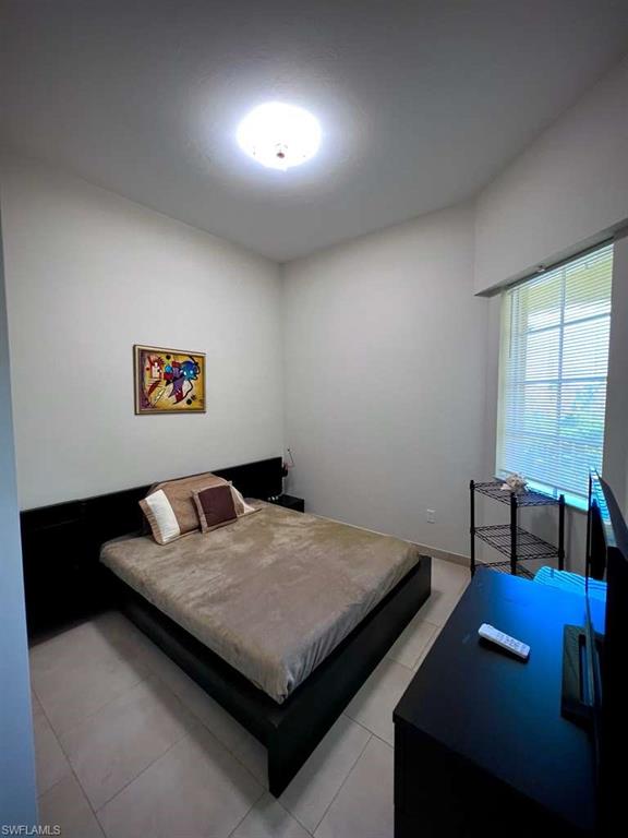 Neutral tone walls with a ceiling-mounted light fixture