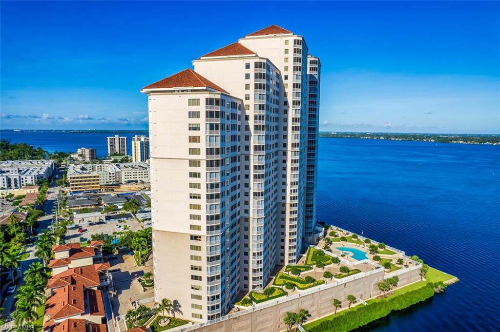View of property with a water view