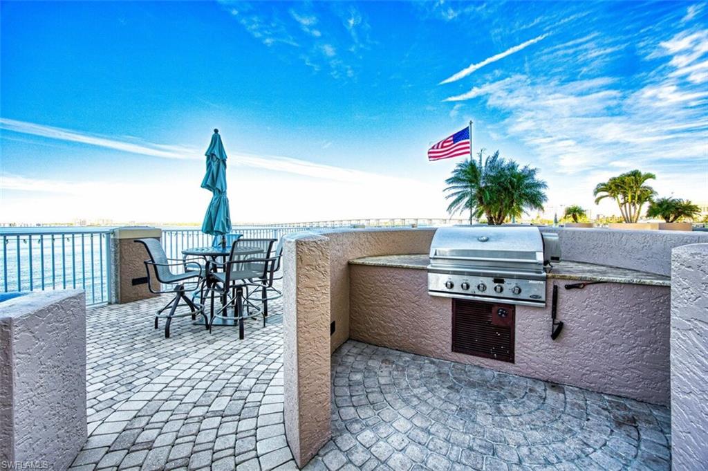 View of patio featuring area for grilling