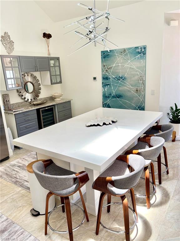 Spacious kitchen island featuring a white countertop and seating for four