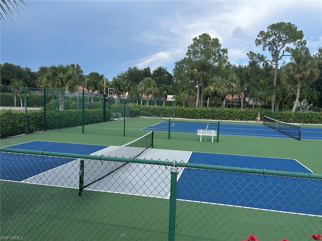 Outdoor recreational courts featuring Pickleball and Tennis with green and blue surfacing, multiple nets, and green chain-link fencing