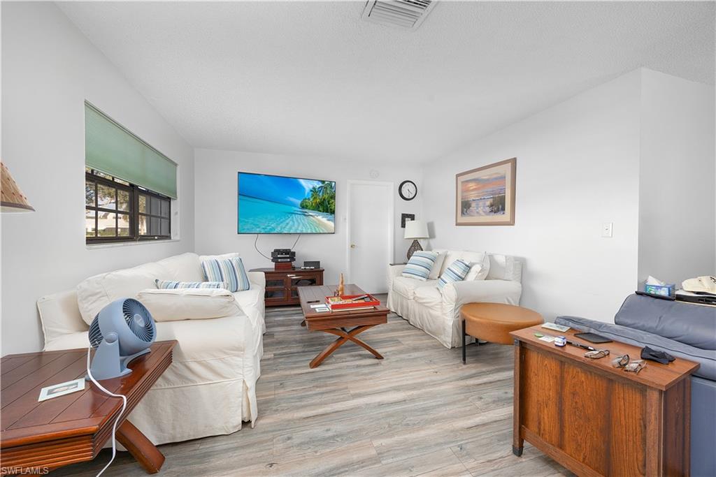 Living area featuring light wood-style flooring