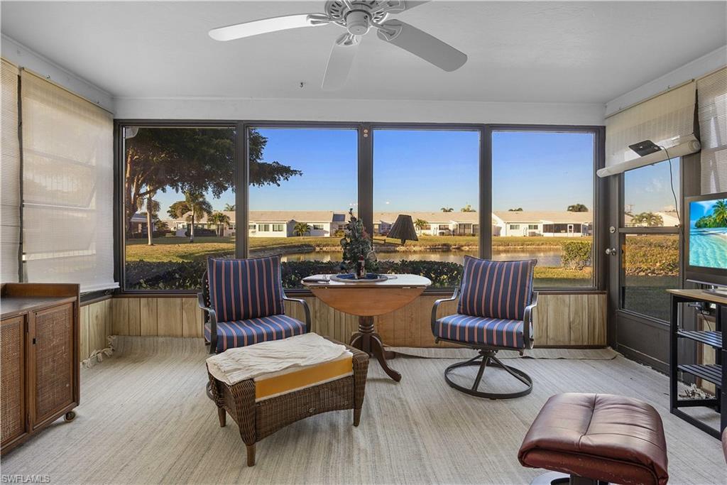 Sunroom / solarium featuring a residential view
