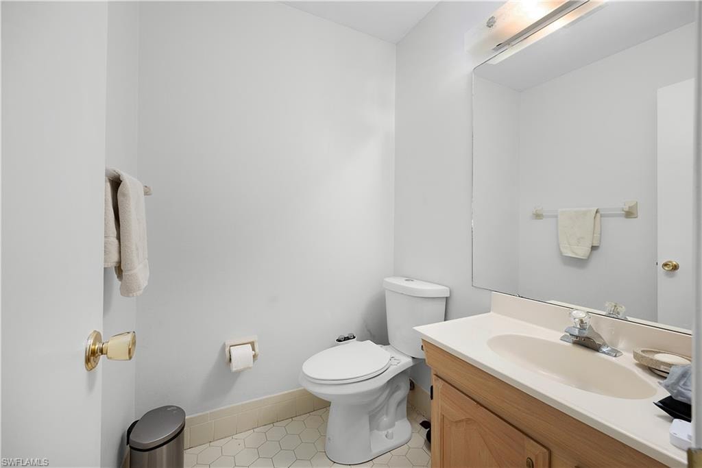 Bathroom with vanity and light tile patterned floors
