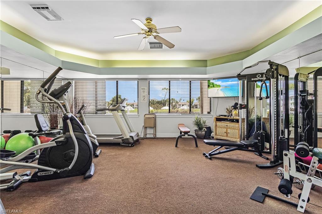Fitness room featuring multiple exercise machines