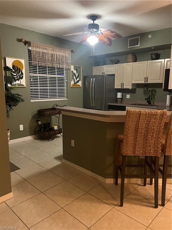 Kitchen with light cabinetry, and stainless-steel appliances