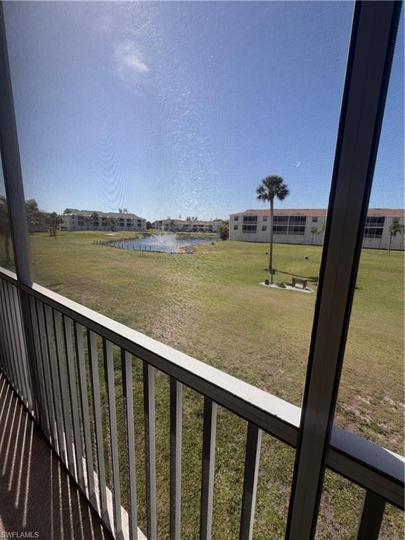 Screend in balcony overlooking golf course and pond