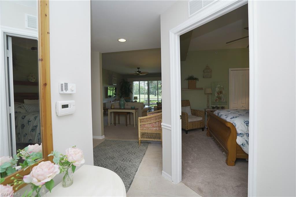 Bathroom featuring tile patterned floors and ceiling fan