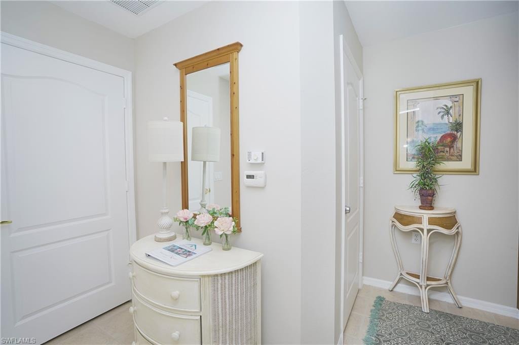 Bathroom with tile patterned flooring