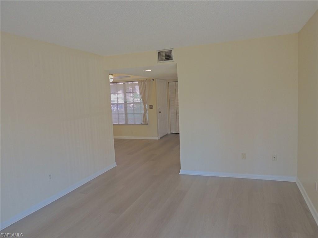 LIVING AREA WITH VIEW OF FRONT ENTRY