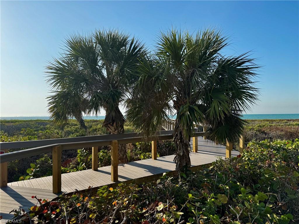 Coastal boardwalk with a wooden deck and railings
