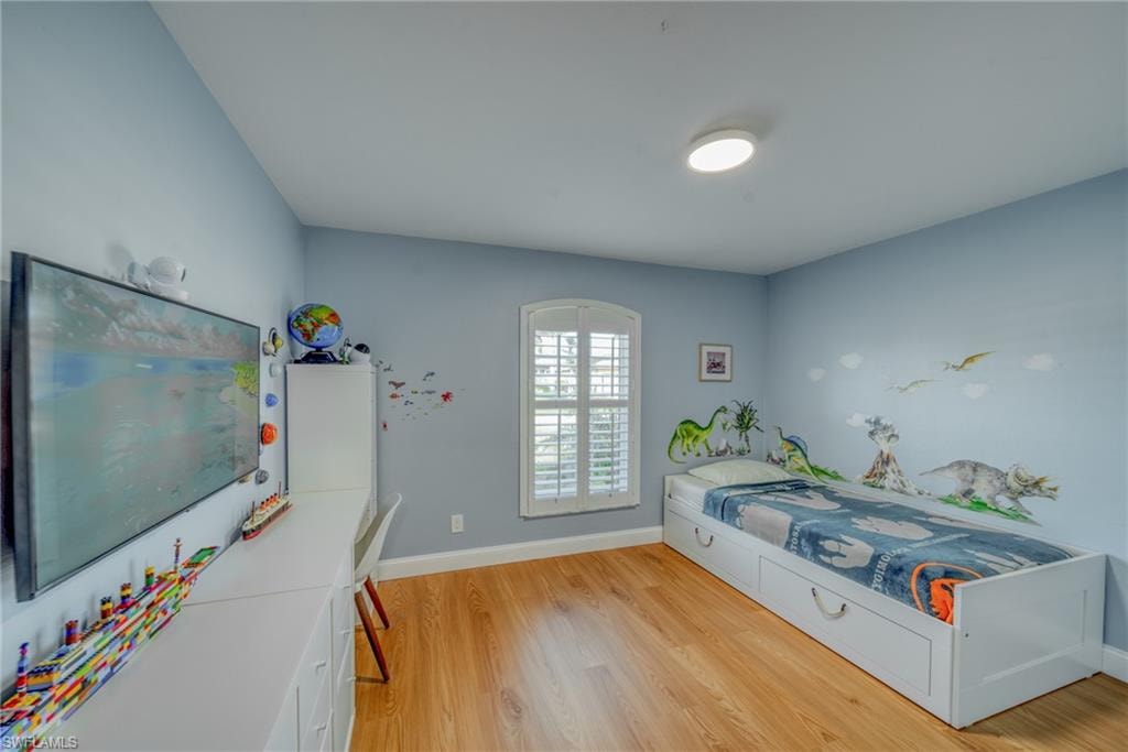 Bedroom with light wood-style flooring