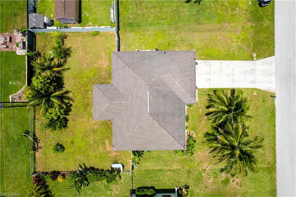 KEY FEATURES INCLUDE Newer Roof (2019),Newer A/C System (2021), Tile FloorsThroughout, 2-Car Garage plus ConcreteDriveway, Screen-Enclosed Lanai, SpaciousBackyard – Room for a Pool, 0.23-Acre Lot(10,019 sq ft), 1,422 sq ft under air